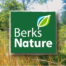 Berks Nature Logo, organic green square with bright blue, green and white leaf, along with meadow photo